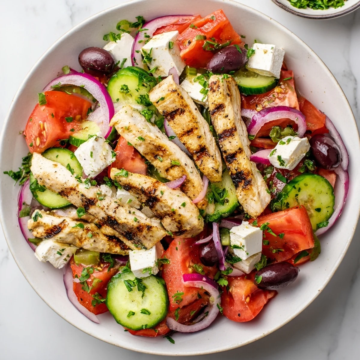 Healthy and flavorful grilled chicken Greek salad, ready for a light and refreshing meal.