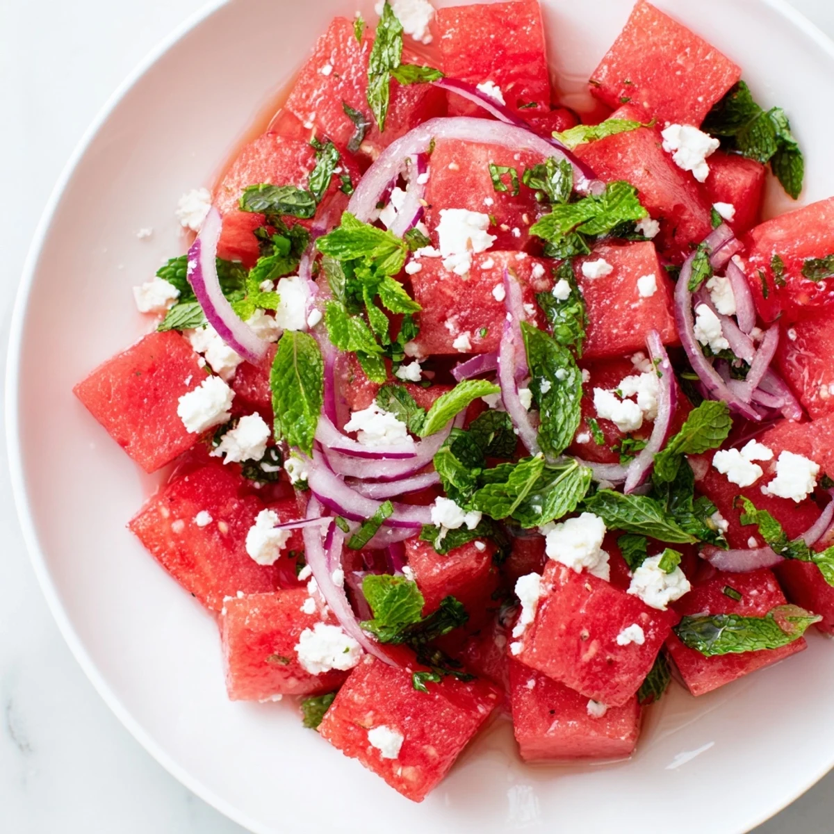 Vibrant Watermelon Feta Salad featuring juicy red watermelon cubes and crumbled salty feta cheese.