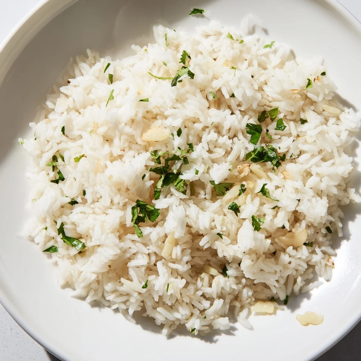 Fluffy, fragrant Jasmine Rice Garlic steamed to perfection and garnished with vibrant green scallions.  