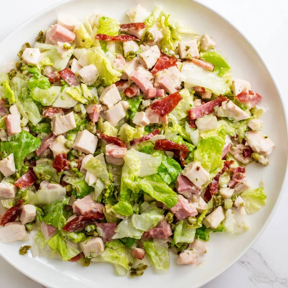 Freshly chopped Italian Deli Chopped Chicken Salad with crisp romaine, cherry tomatoes, and a tangy herb dressing.