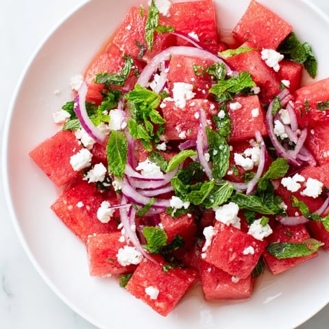 Vibrant Watermelon Feta Salad featuring juicy red watermelon cubes and crumbled salty feta cheese.