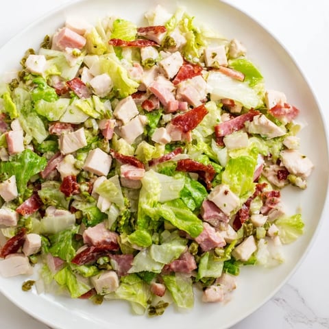 Freshly chopped Italian Deli Chopped Chicken Salad with crisp romaine, cherry tomatoes, and a tangy herb dressing.