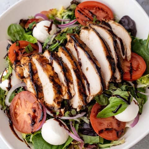 Fresh Caprese Chicken Salad with creamy mozzarella and a glistening balsamic drizzle.
