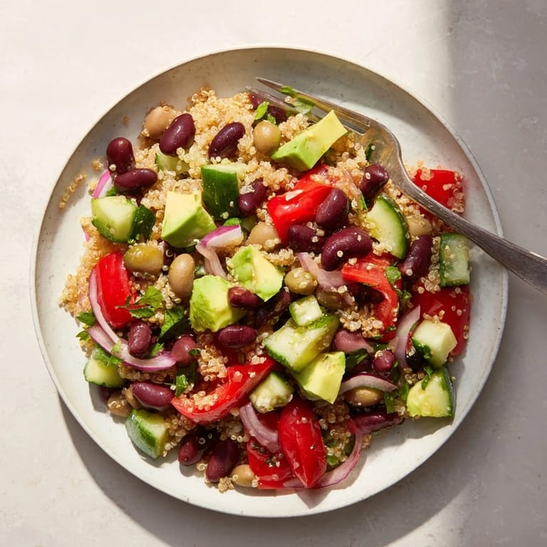 A big bowl of refreshing quinoa and black bean salad with lime, the perfect healthy lunch.