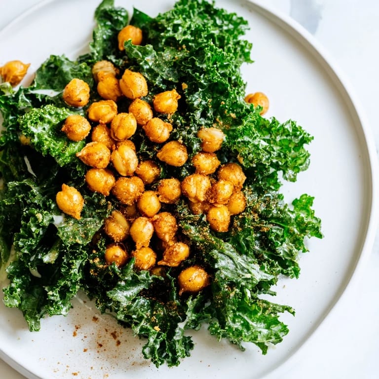 Golden, crispy chickpeas crown this warm kale salad, tossed in a bright lemon dressing.