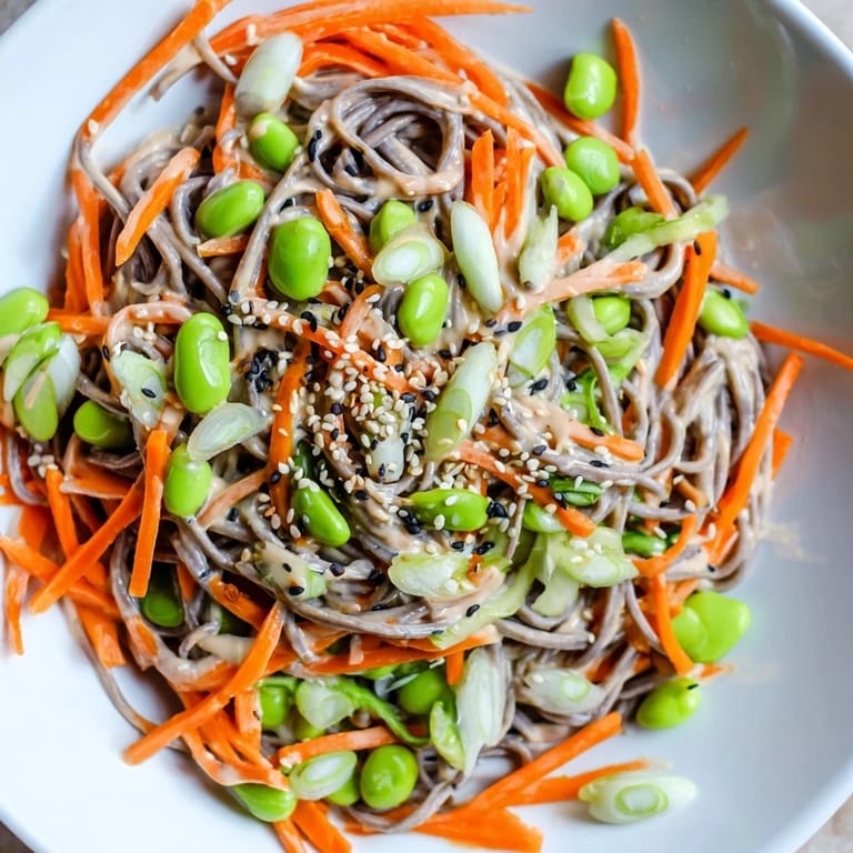 Bright bowl of Asian Sesame Noodle Salad with sesame seeds, perfect for a refreshing lunch.