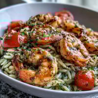 One-Pan Lemon Butter Shrimp and Orzo with vibrant vegetables and fresh herbs, served hot and ready to enjoy.